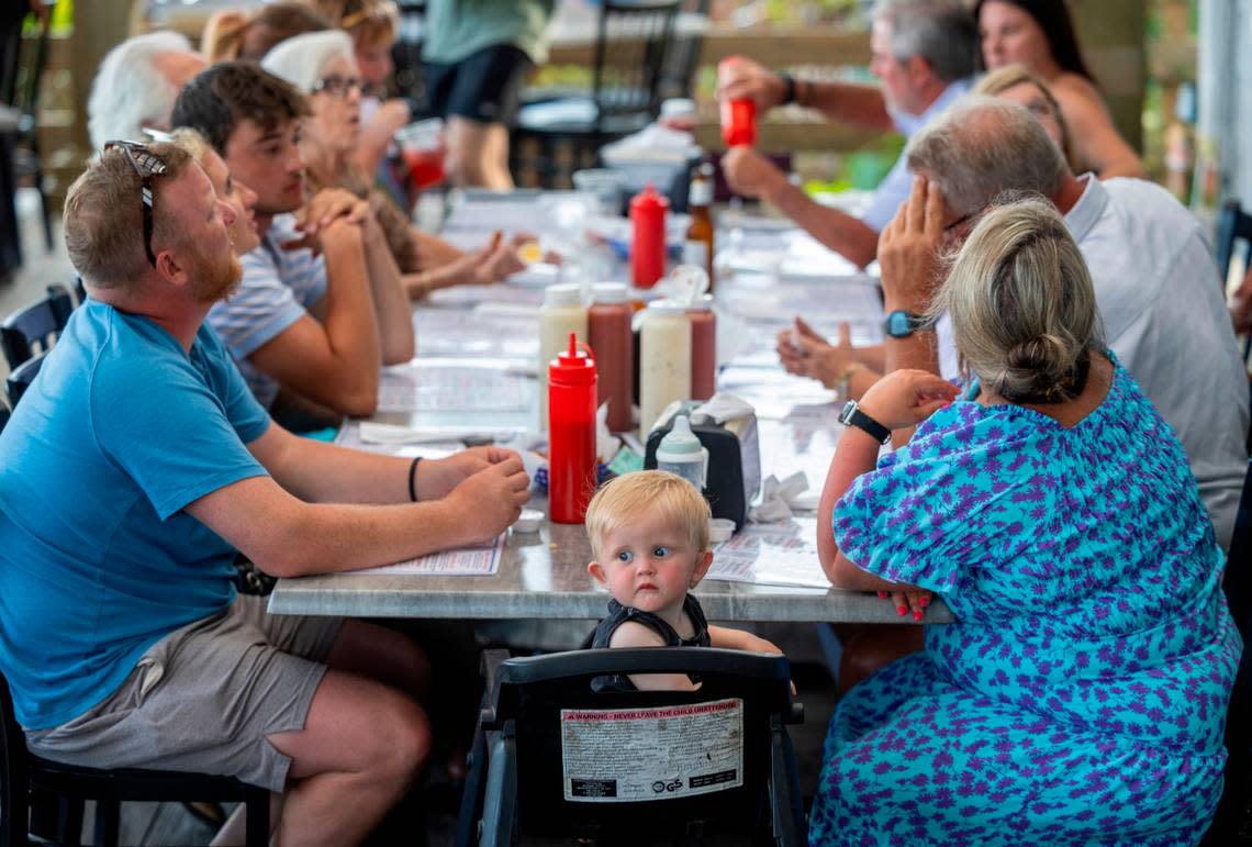 Fifteen-month-old Maverick Thompson of Greenwood, S.C. enjoys his first visit to Captain Nance’s Seafood with his family on Friday, June 28, 2024 in Calabash, N.C.