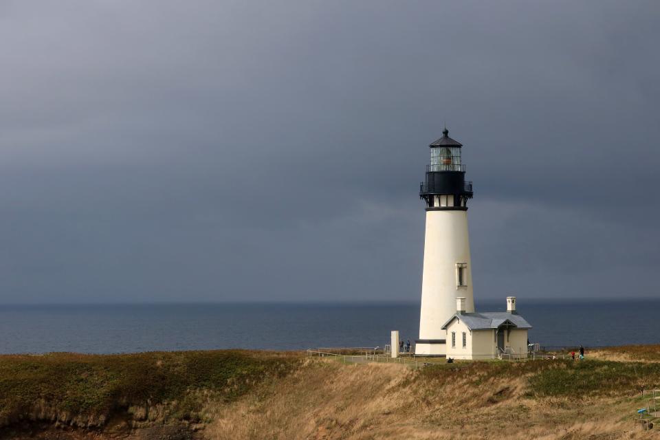 Yaquina Head Lighthouse on the central Oregon coast near Newport lit by afternoon sunlight. (Photo by: Education Images/Universal Images Group via Getty Images)