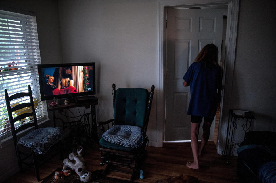 Allen walks through her home in Lumberton after deciding not to follow mandatory evacuation orders.