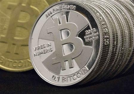 Some of Bitcoin enthusiast Mike Caldwell's coins are pictured at his office in this photo illustration in Sandy, Utah in this January 31, 2014 file photo. REUTERS/Jim Urquhart