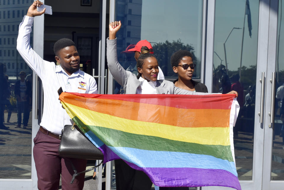 Activists celebrate outside the High Court in Gaborone, Botswana, Tuesday June 11, 2019. Botswana became the latest country to decriminalize gay sex when the High Court rejected as unconstitutional sections of the penal code that punish same-sex relations with up to seven years in prison. (AP Photo)