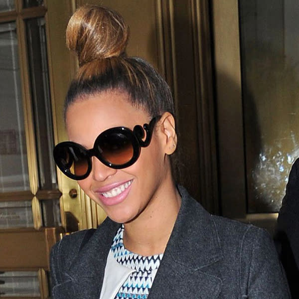 <b>Beyonce</b> has clearly mastered the chic, yet funky topknot. We'll be working on perfecting ours in 2013 ©Rex