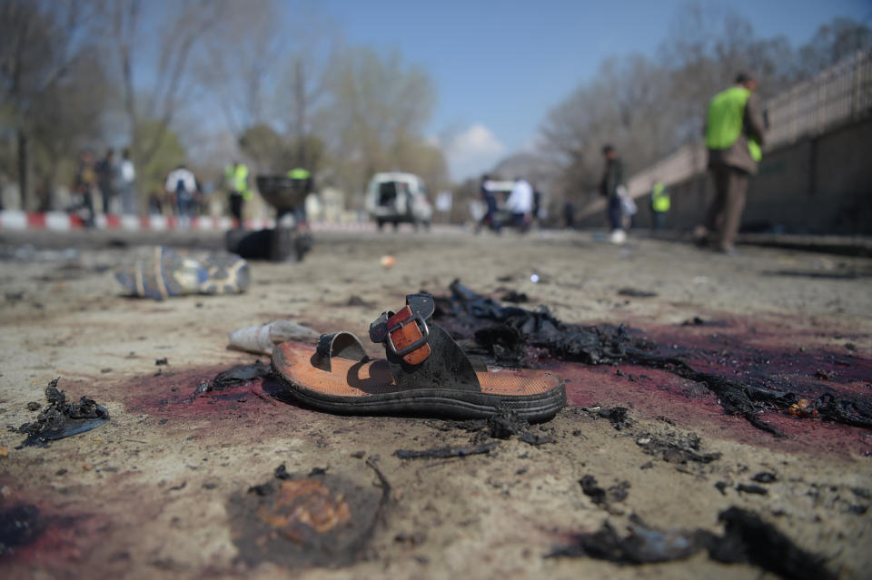 <p>A sandal is seen laying on the ground along a road at the site of a suicide bombing attack in Kabul on March 21, 2018.<br> A suicide bomber on March 21 killed at least 26 people, many of them teenagers, in front of Kabul University, officials said, as Afghans took to the streets to celebrate the Persian new year holiday. The Islamic State group claimed responsibility for the deadly attack — the fifth suicide bombing in the Afghan capital in recent weeks — via its propaganda arm Amaq, SITE Intelligence Group said. The Taliban earlier denied involvement on Twitter. (Photo: Shah Marai/ AFP/Getty Images) </p>