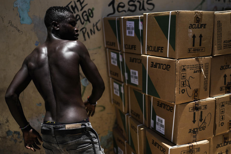 A man unloads a grocery truck in a neighborhood known as Little Haiti in Santo Domingo, Dominican Republic, Thursday, May 16, 2024. (AP Photo/Matias Delacroix)