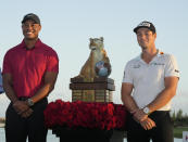 Tiger Woods, left, and Viktor Hovland, of Norway, pose for a photo after he winning the Hero World Challenge PGA Tour at the Albany Golf Club, in New Providence, Bahamas, Sunday, Dec. 4, 2022. (AP Photo/Fernando Llano)