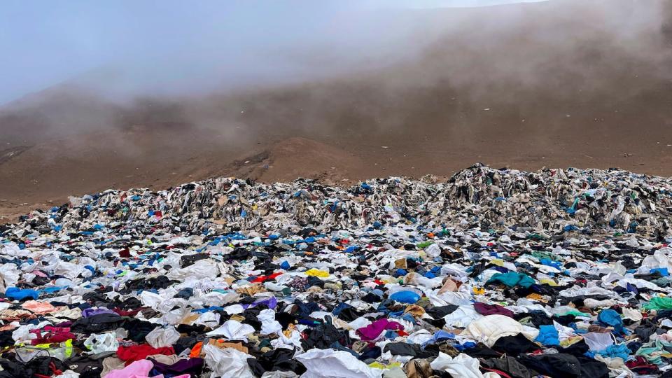 Used clothes are shown discarded in the Atacama Desert, in Alto Hospicio, Chile. In 2021, the World Economic Forum identified the fashion industry as the world’s third-largest polluter. (Martin Bernetti/AFP/Getty  - image credit)