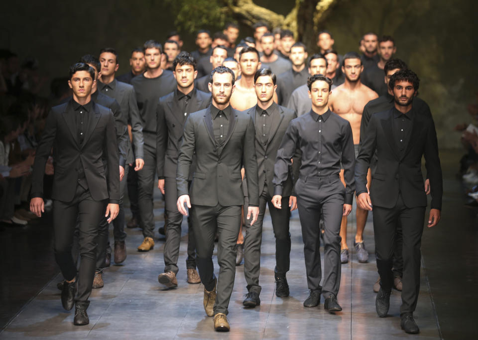 Models wear creations of the Dolce & Gabbana men's Spring-Summer 2014 collection, part of the Milan Fashion Week, unveiled in Milan, Italy, Saturday, June 22, 2013. (AP Photo/Luca Bruno)