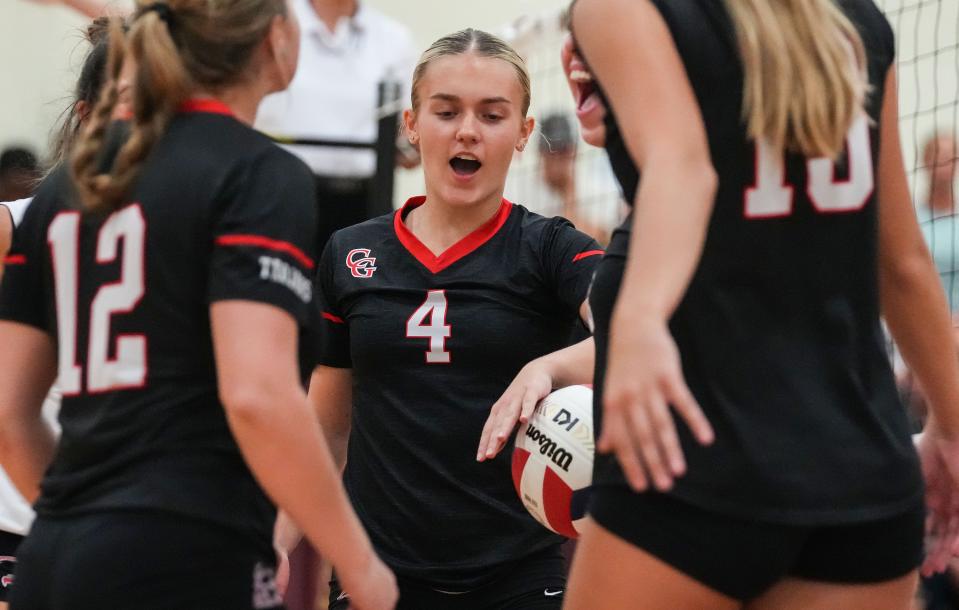 Center Grove Trojans Sophie Sabol (4) yells in excitement with teammates Thursday, Sept. 14, 2023, during the game at Brebeuf Jesuit Preparatory School in Indianapolis. The Center Grove Trojans defeated Brebeuf Jesuit, 3-2.