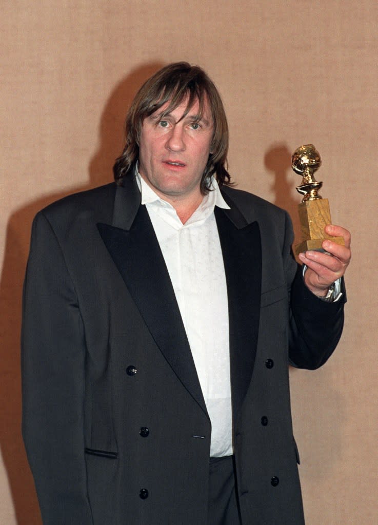 Depardieu, holding his Golden Globe award he won for Best Actor in a Comedy for his performance in “Green Card” during the 48th Annual Golden Globe Award ceremony. AFP FILES/AFP via Getty Images