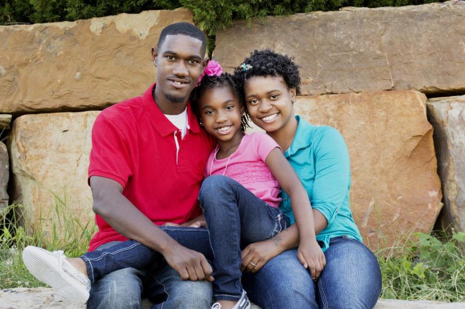 This 2013 image released by the Parker Family shows Terrence Parker, left, daughter Tiana, 7, center, and wife Miranda Parker in Tulsa, Okla. Tiana was at the center of a debate over her hairstyle. (AP Photo/The Parker Family, Marq Lewis)