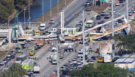 Aerial view shows a pedestrian bridge collapsed at Florida International University in Miami, Florida, U.S., March 15, 2018. REUTERS/Joe Skipper