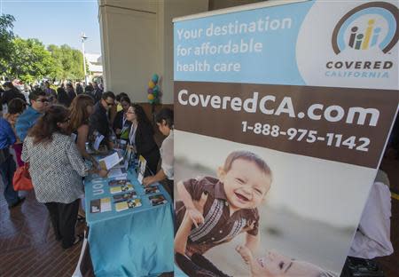 People sign up for health insurance information at a Covered California event which marks the opening of the state's Affordable Healthcare Act, commonly known as Obamacare, health insurance marketplace in Los Angeles, California, October 1, 2013. REUTERS/Lucy Nicholson