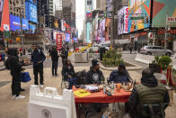 Tunde Onakoya, a Nigerian chess champion and child education advocate, plays a chess game in Times Square, Friday, April 19, 2024, in New York. (AP Photo/Yuki Iwamura)