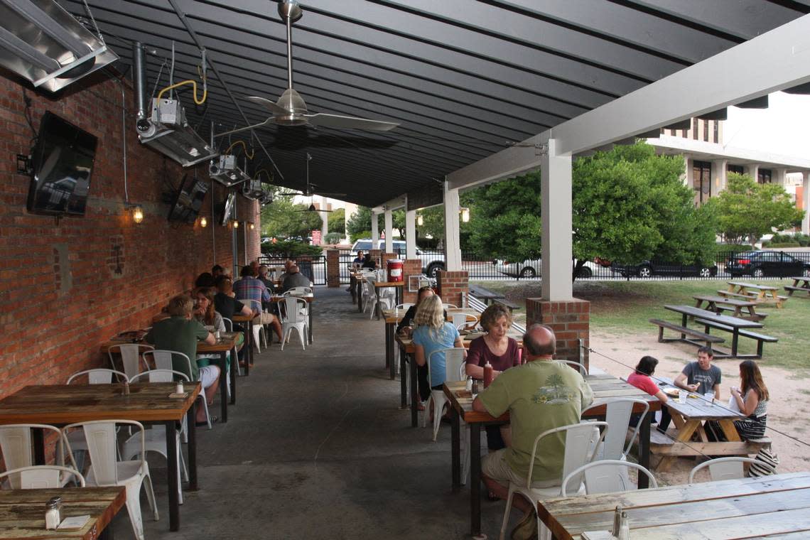 Bull McCabe’s Irish bar, photographed in 2014, keeps a grassy patch of picnic tables in the heart of downtown Durham, which, pandemic or not, has long been one of the Triangle’s best spots for an outdoor drink.