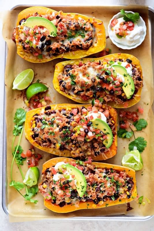 <p>You'll be adding this to your weekly dinner rotation, guaranteed! Get the recipe for <strong><a href="https://tidymom.net/2017/southwest-black-bean-stuffed-butternut-squash/" rel="nofollow noopener" target="_blank" data-ylk="slk:Southwest Black Bean Stuffed Butternut Squash;elm:context_link;itc:0;sec:content-canvas" class="link ">Southwest Black Bean Stuffed Butternut Squash</a>.</strong></p>