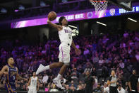 FILE - NBA G League Ignite's Scoot Henderson dunks against Boulogne-Levallois Metropolitans 92 during the first half of an exhibition basketball game Oct. 4, 2022, in Henderson, Nev. Henderson is among the top prospects in next month’s NBA draft. (AP Photo/John Locher, File)