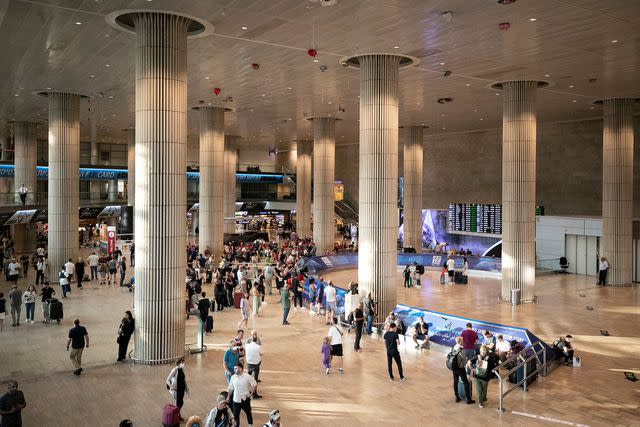 <p>Chen Junqing/Getty Images</p> Travelers at Ben Gurion International Airport near Tel Aviv, Israel on Oct. 8, 2023. International airlines delayed or cancelled their flights bound for Israel due to the ongoing Israeli-Palestinian conflict erupted last weekend.