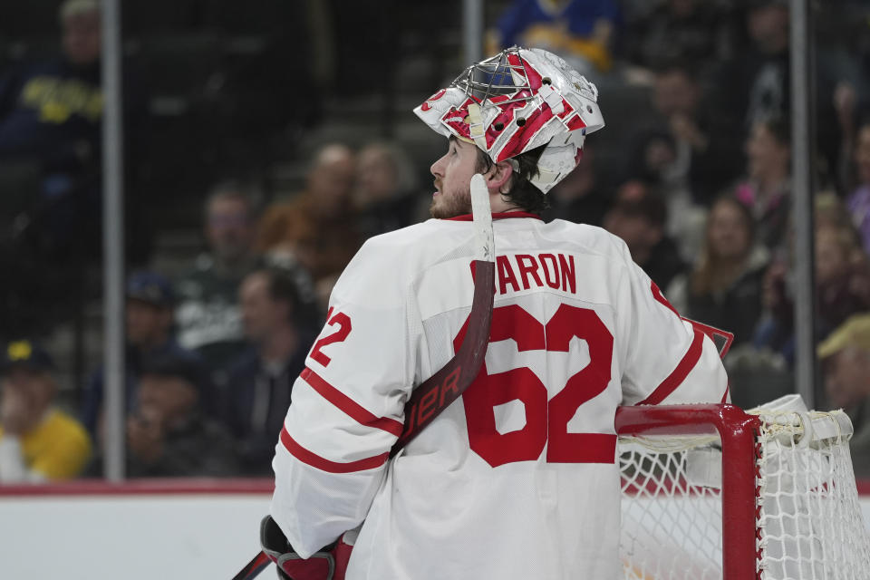 Boston University goaltender Mathieu Caron (62) looks at the videoboard after a goal scored by Denver forward Tristan Lemyre during the second period of a semifinal game at the Frozen Four NCAA college hockey tournament Thursday, April 11, 2024, in St. Paul, Minn. (AP Photo/Abbie Parr)
