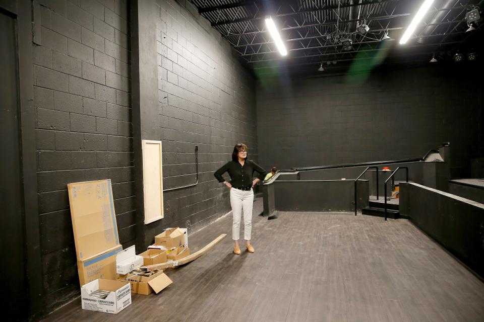 Kathryn McGill, Oklahoma Shakespeare's executive and artistic director and co-founder, stands on the under-renovation indoor stage at the Oklahoma Shakespeare in the Paseo district, in Oklahoma City, Tuesday, July 20, 2021. The company will debut its revamped black box theater July 29, opening night for its production of "Venus in Fur."