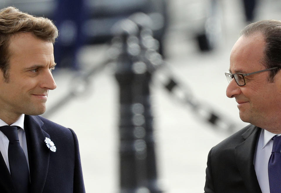 <p>French President-elect Emmanuel Macron, left, and outgoing President Francois Hollande, attend a ceremony to mark the end of World War II at the Arc de Triomphe in Paris, Monday, May 8, 2017. Macron defeated far-right leader Marine Le Pen handily in Sunday’s presidential vote, and now must pull together a majority for his year-old political movement by mid-June legislative elections. (Philippe Wojazer, Pool via AP) </p>