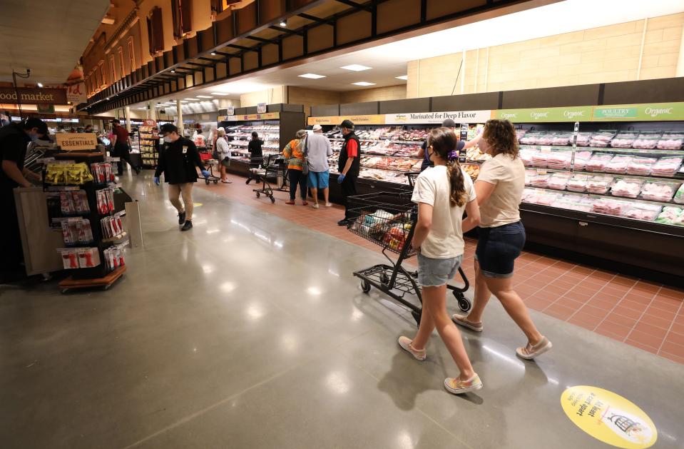 Shoppers browse the meat aisle on the opening day of the Wegmans in Harrison, Aug. 5, 2020. 