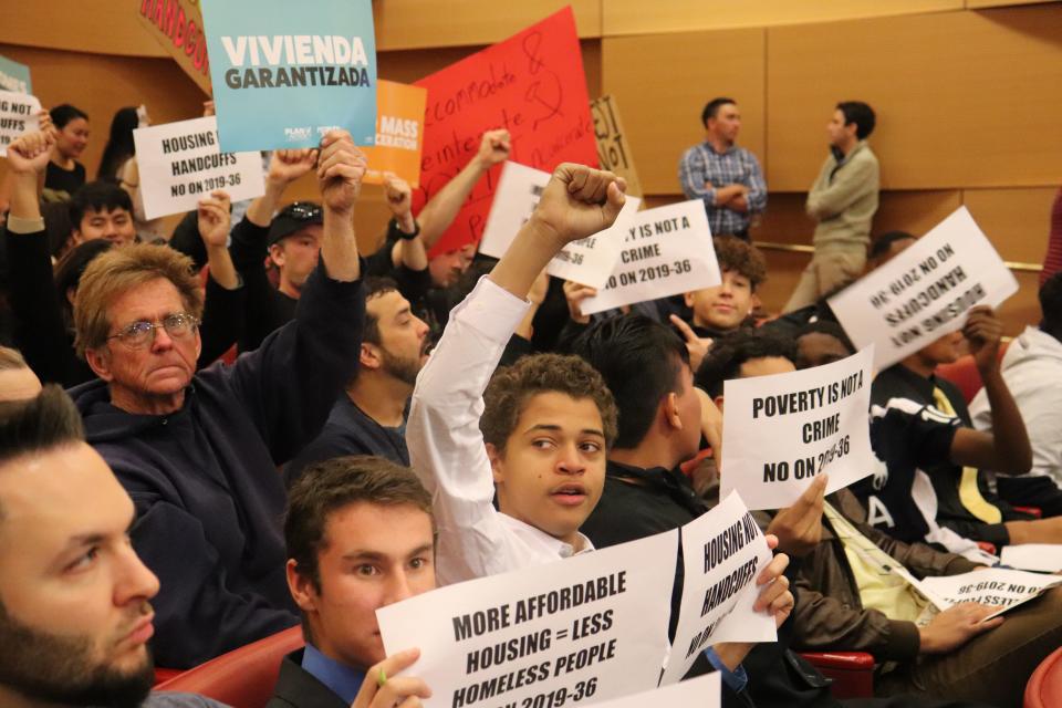 Protesters flooded Las Vegas City Hall Wednesday to oppose a new ordinance that would criminalize sleeping on Las Vegas sidewalks.