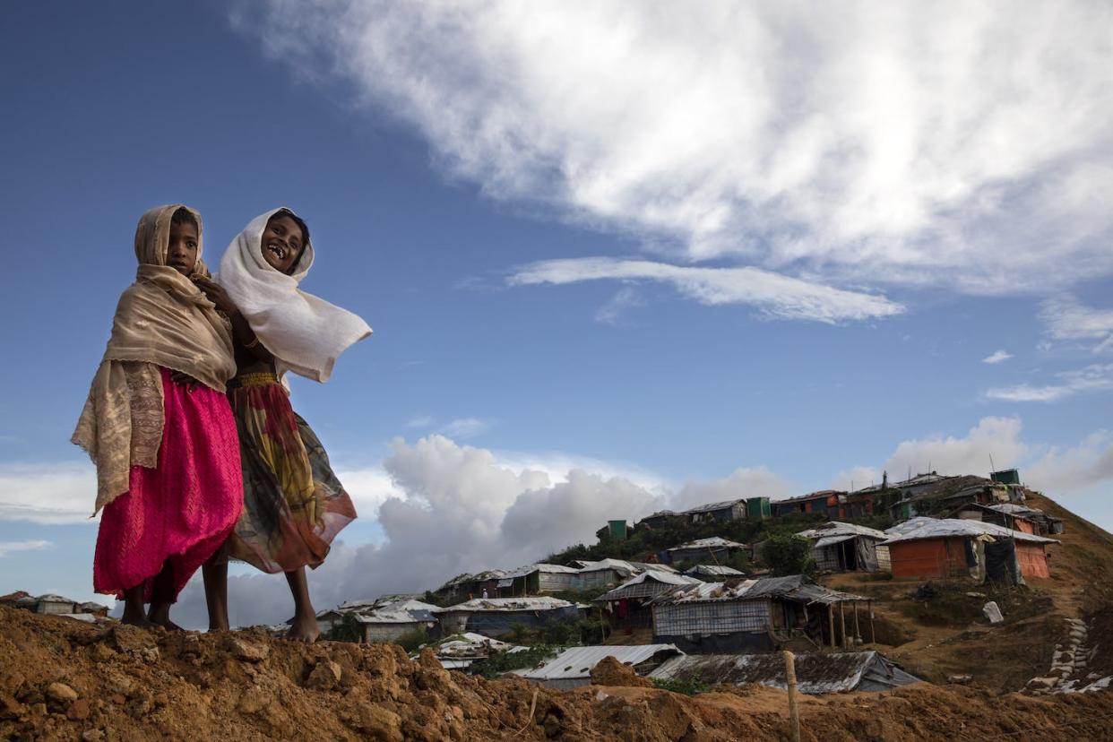 Rohingya girls share a laugh in Kutupalong, the world's largest refugee camp in Bangladesh. <a href="https://media.gettyimages.com/id/1024026662/photo/rohingya-refugees-mark-one-year-since-the-crisis.jpg?s=1024x1024&w=gi&k=20&c=5nx1vrDQTLqscJJfQ2i3H68piCF9lDmYeRwvTea1atg=" rel="nofollow noopener" target="_blank" data-ylk="slk:Paula Bronstein/Getty Images;elm:context_link;itc:0;sec:content-canvas" class="link ">Paula Bronstein/Getty Images</a>