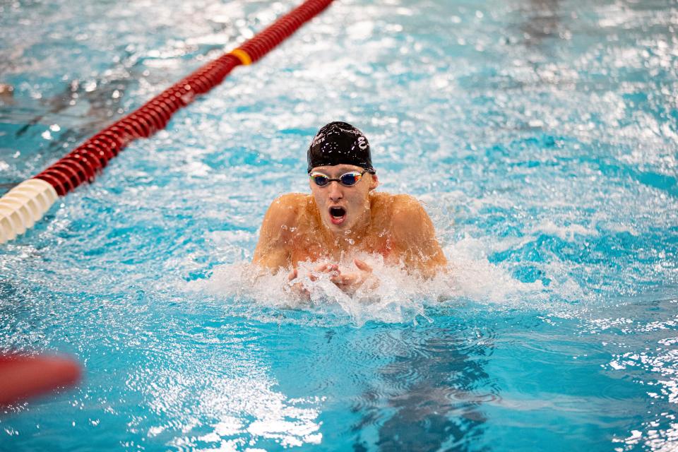 East senior Camden Taylor, shown breaking the NIC-10 record in the 100 breaststroke Saturday, Feb. 11, 2023, at Jefferson High School in Rockford, now holds the conference record in all eight individual boys swimming events.