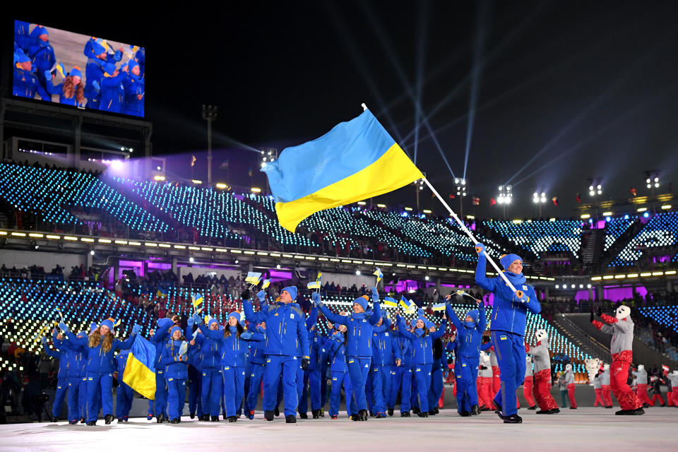 <p>Flag bearer of The Ukraine Olena Pidhrushna and teammates enter the stadium during the Opening Ceremony of the PyeongChang 2018 Winter Olympic Games at PyeongChang Olympic Stadium on February 9, 2018 in Pyeongchang-gun, South Korea. (Photo by Matthias Hangst/Getty Images) </p>