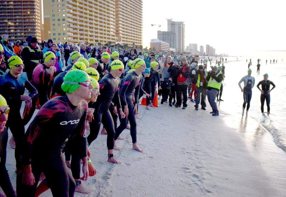 Triathletes prepare to begin the Visit Panama City Beach IRONMAN Florida in 2021. The 2022 version of the triathlon is expected to cause traffic delays throughout the city on Saturday.