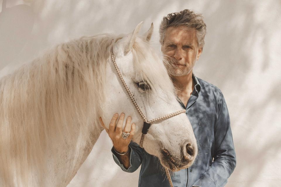 Jean-Pierre Marois and one of the resident horses.