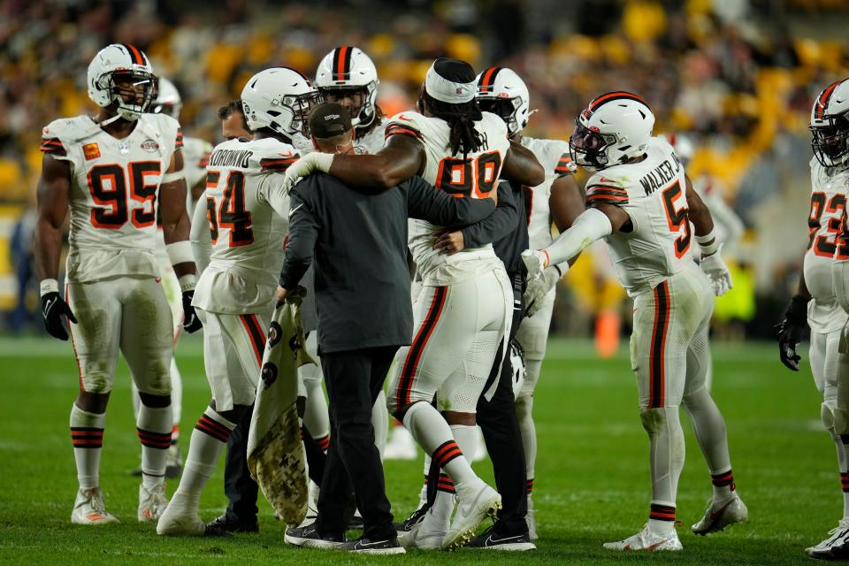 Cleveland Browns defensive end Za'Darius Smith (99) is helped off the field during the second half of an NFL football game Monday, Sept. 18, 2023, in Pittsburgh. (AP Photo/Gene J. Puskar)