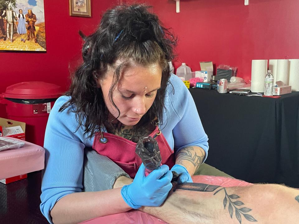 Josie Pedraza tattooing a portrait of Ghostface on Monday. She opened her tattoo studio, JDRAZAINK, on March 1.