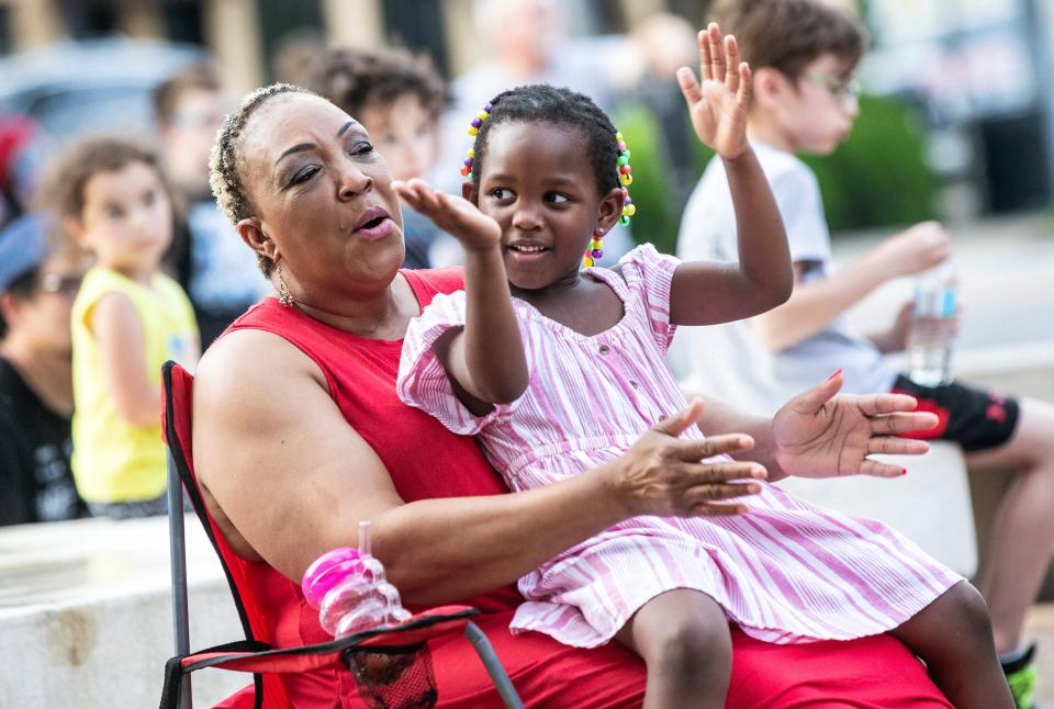 Doris Watkins, left, claps with her granddaughter, Zawadi Odhiambo, 4, during a Juneteenth celebration in Florence, Alabama. (Dan Busey / The Times Daily / AP)