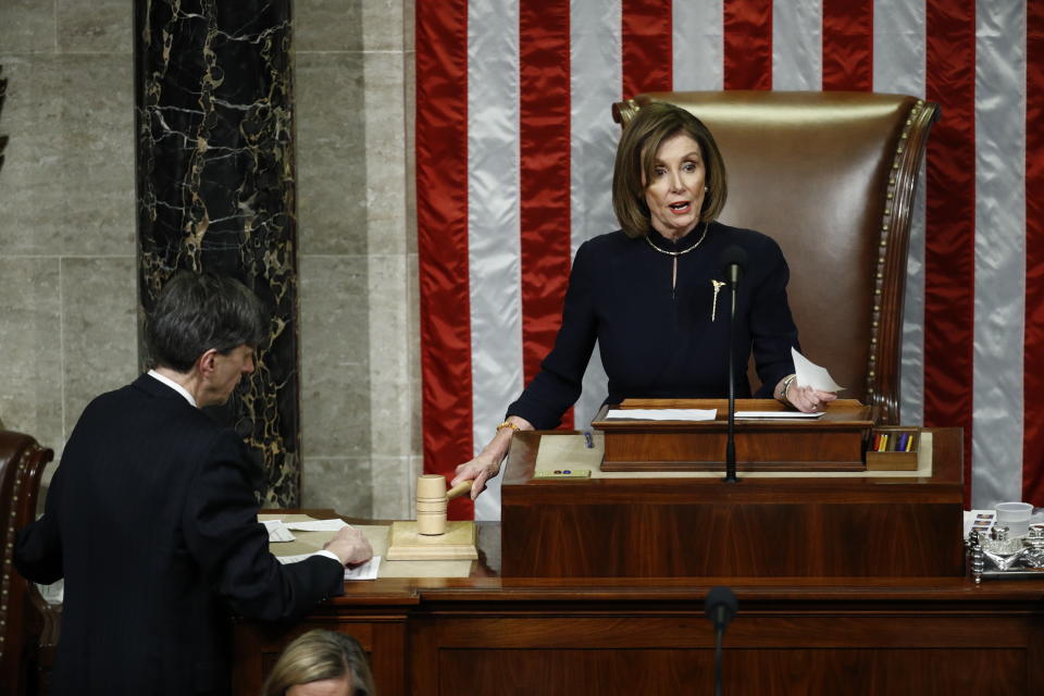 House Speaker Nancy Pelosi of Calif., strikes the gavel after announcing the passage of article II of impeachment against President Donald Trump, Wednesday, Dec. 18, 2019, on Capitol Hill in Washington. (AP Photo/Patrick Semansky)