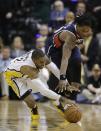 Indiana Pacers' C.J. Watson (32) and Atlanta Hawks' Cartier Martin (20) dive for a loose ball during the second half in Game 2 of an opening-round NBA basketball playoff series Tuesday, April 22, 2014, in Indianapolis. Indiana defeated Atlanta 101-85. (AP Photo/Darron Cummings)