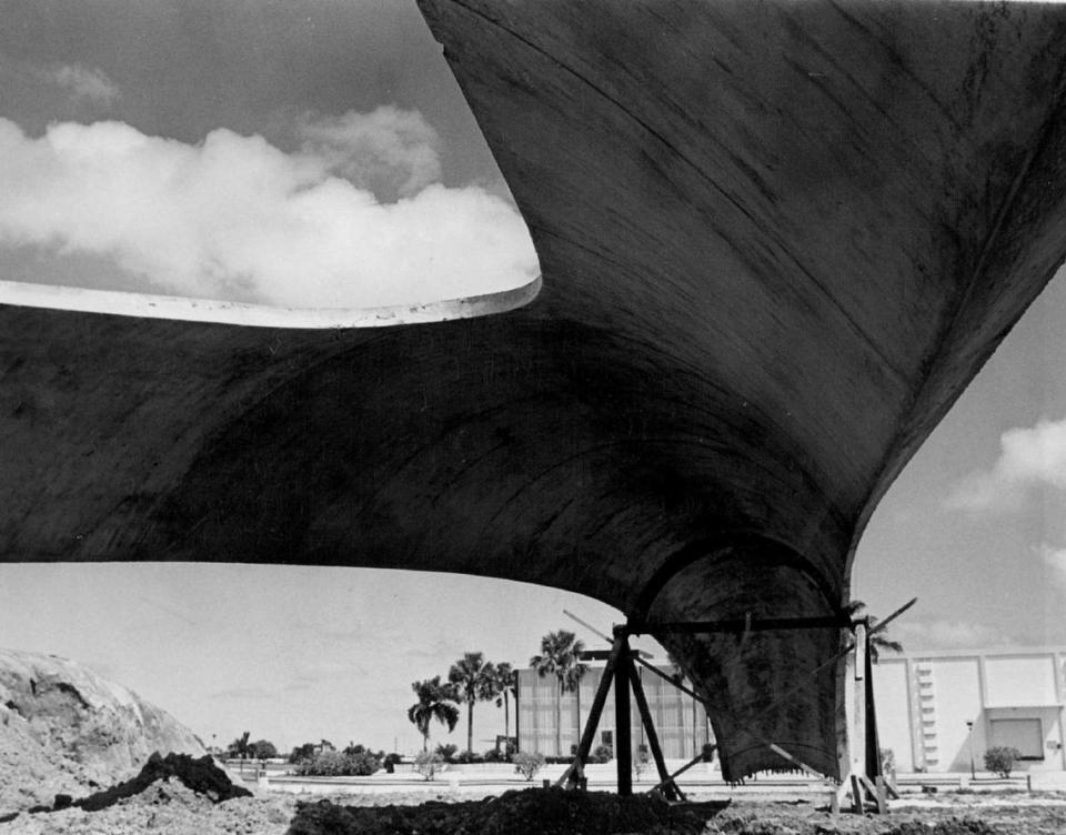 In October 1963, the looming bulk of a 100-foot precast concrete support waits for a twin, to be joined with it forming the towering arch, gateway to the Sunshine State Industrial Park.