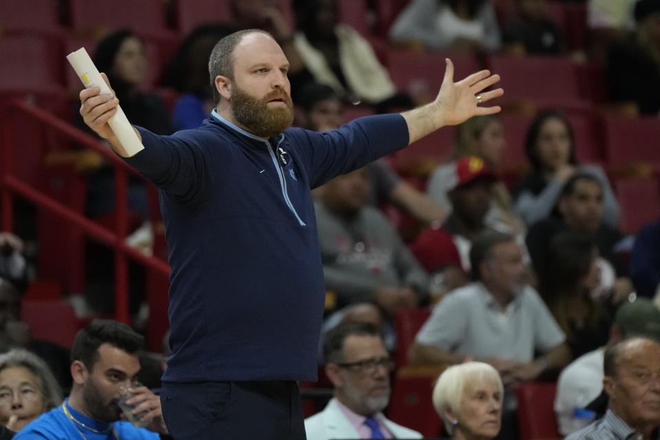 Memphis Grizzlies coach Taylor Jenkins reacts to a referee's call during the first half of the team's NBA basketball game against the Miami Heat, Wednesday, March 15, 2023, in Miami. (AP Photo/Rebecca Blackwell)