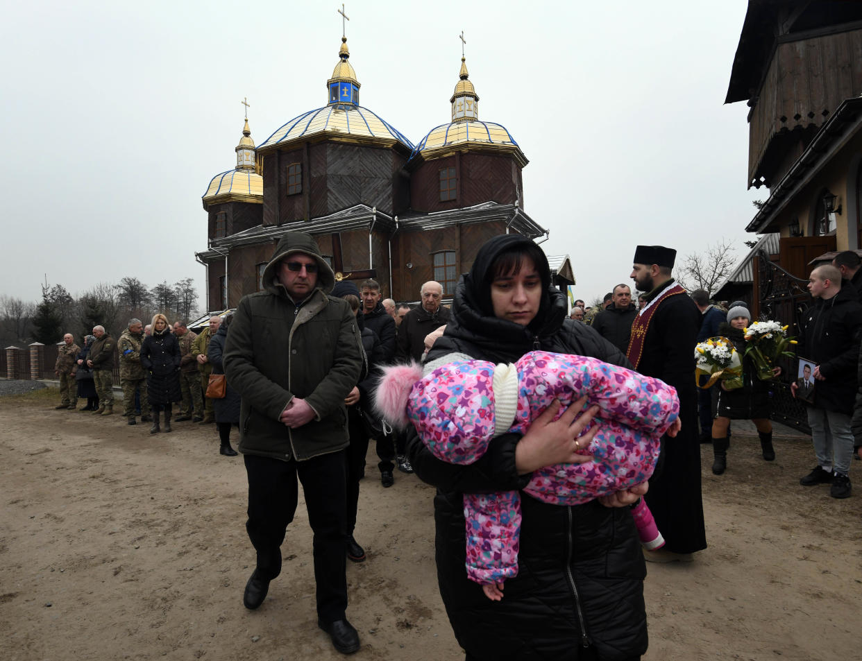 People process through town following a church service.