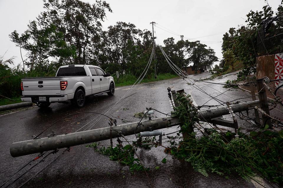 Downed power lines on road PR-743 in Cayey ,Puerto Rico as the island awoke to a general power outage on September 19, 2022 in San Juan, Puerto Rico. Hurricane Fiona struck this Caribbean nation causing extensive damages related to flooding after many towns in the mountainous and southern region received in some cases over twenty inches of rain.