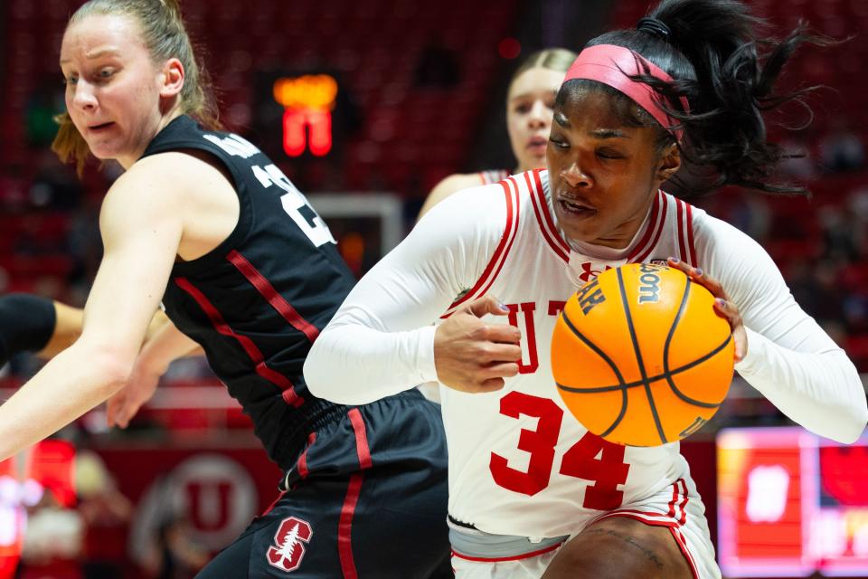 Utah Utes forward Dasia Young (34) drives the ball past Stanford Cardinal guard Elena Bosgana (20) during a college women’s basketball game between the Utah Utes and the Stanford Cardinal at the Jon M. Huntsman Center in Salt Lake City on Friday, Jan. 12, 2024. | Megan Nielsen, Deseret News