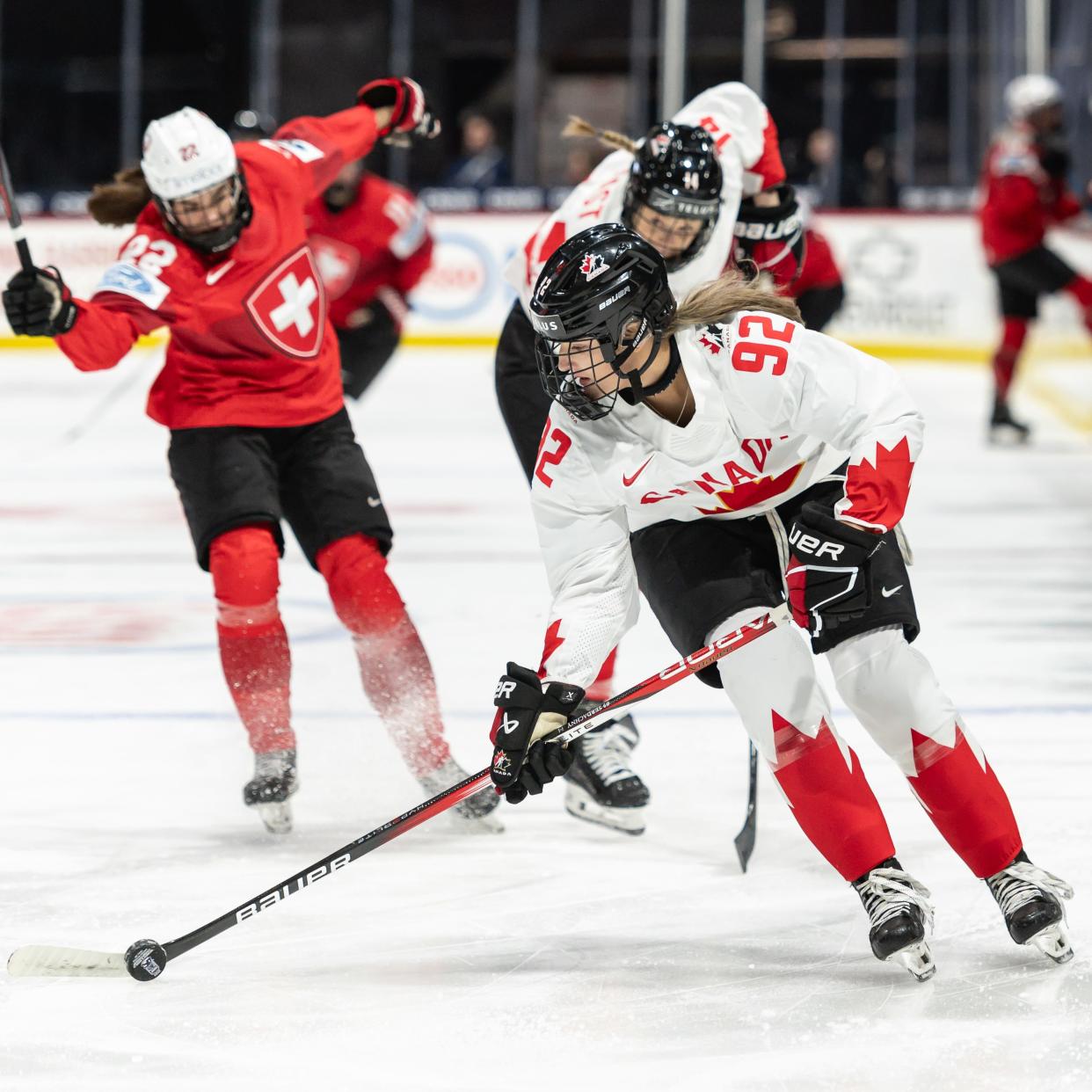 Canada's Danielle Serdachny, a member of the Colgate University women's ice hockey team, controls the puck during a game against Switzerland during the International Ice Hockey Federation Women's World Championship at the Adirondack Bank Center in Utica, NY on Friday, April 5, 2024.