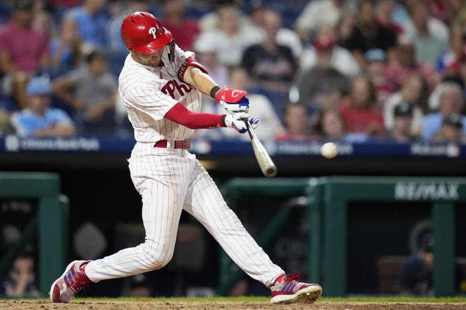 Philadelphia Phillies' Trea Turner hits a run-scoring double against Atlanta Braves pitcher Jackson Stephens during the fourth inning of the second baseball game in a doubleheader, Monday, Sept. 11, 2023, in Philadelphia. (AP Photo/Matt Slocum)