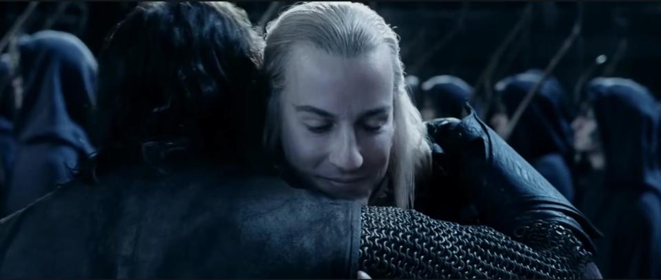 Haldir and Aragorn embrace.