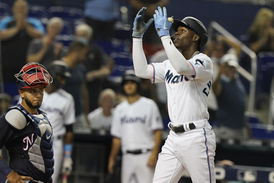 Miami Marlins' Jazz Chisholm Jr. gestures to the crowd after hitting his second solo home run of the game during the fifth inning of a baseball game against the Washington Nationals, Monday, Sept. 20, 2021, in Miami. (AP Photo/Marta Lavandier)