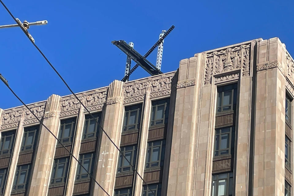 A large, metal "X" sign is seen on top of the downtown building that housed what was once Twitter, now rebranded by its owner, Elon Musk, in San Francisco, Friday, July 28, 2023. The new metal X marker appeared after police stopped workers on Monday, July 24, from removing the iconic bird and logo, saying they didn't have the proper permits and didn't tape off the sidewalk to keep pedestrians safe if anything fell. (AP Photo/Haven Daley)