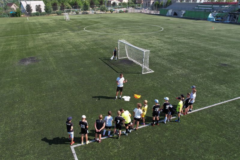 Young players of the Olymp football club attend a training session at the Central stadium in the town of Irpin