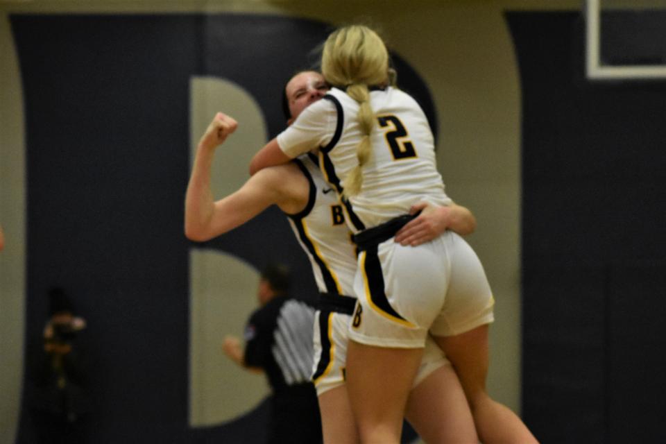 Battle's KJ Johnson and Maliyah Miller celebrate after the final buzzer sounds from the Spartans' win over Rock Bridge on Dec. 6, 2022, at Battle High School in Columbia, Mo.