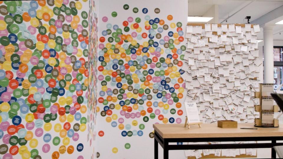 PHOTO: A sticker wall that encourages visitors to state their climate action intentions has garnered thousands of stickers since the museum opened in October. (ABC News)