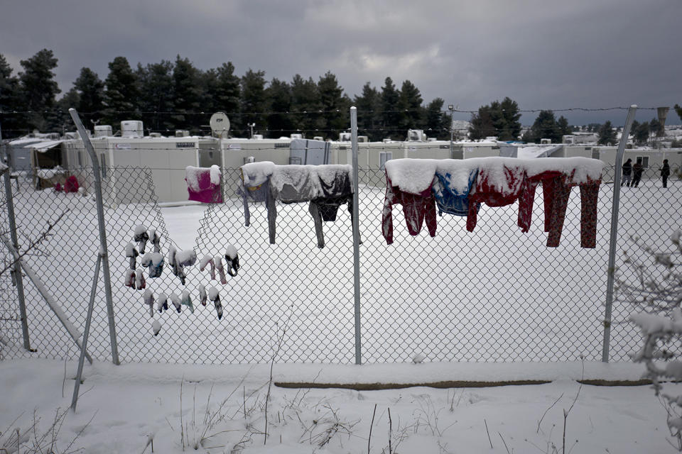 <p>Laundry of Syrian refugees is covered with snow while hung on a fence at the refugee camp of Ritsona about 86 kilometers (53 miles) north of Athens, Jan. 10, 2017. (Photo: Muhammed Muheisen/AP) </p>